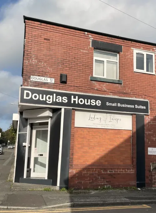 Douglas House Small Business Suites sign at the corner of Belmont Road and Douglas Street, Bolton
